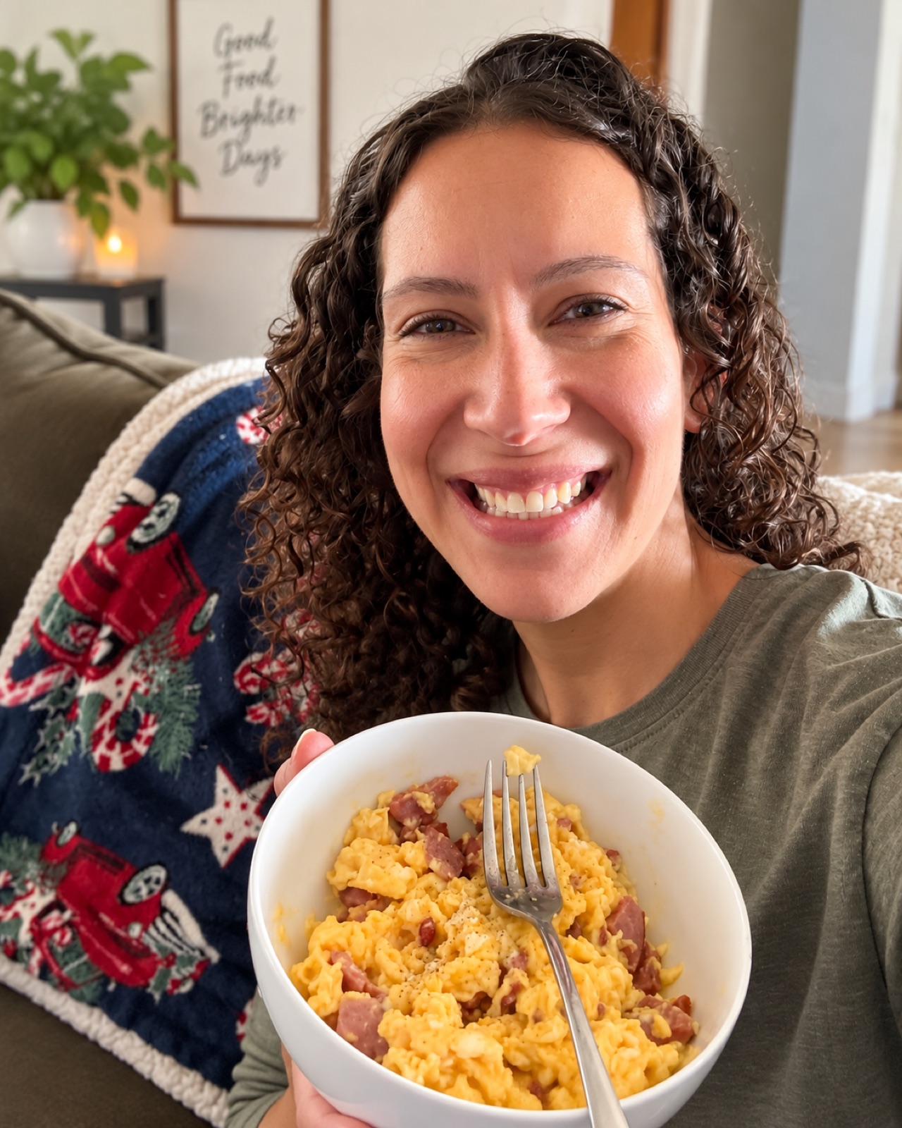 Bekah smiling at home with a bowl of eggs and meat